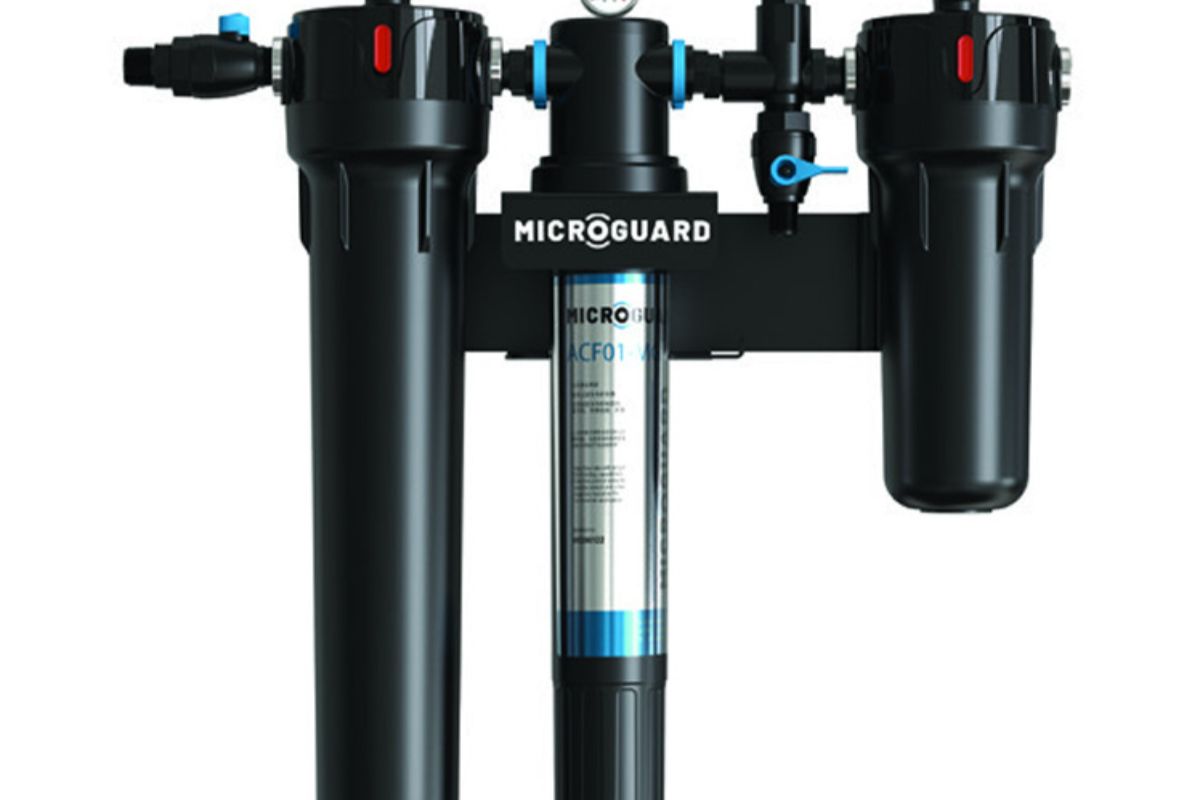 Pentair MicroGuard filtration unit with black housings, blue connectors, and a central cartridge for commercial kitchen water treatment